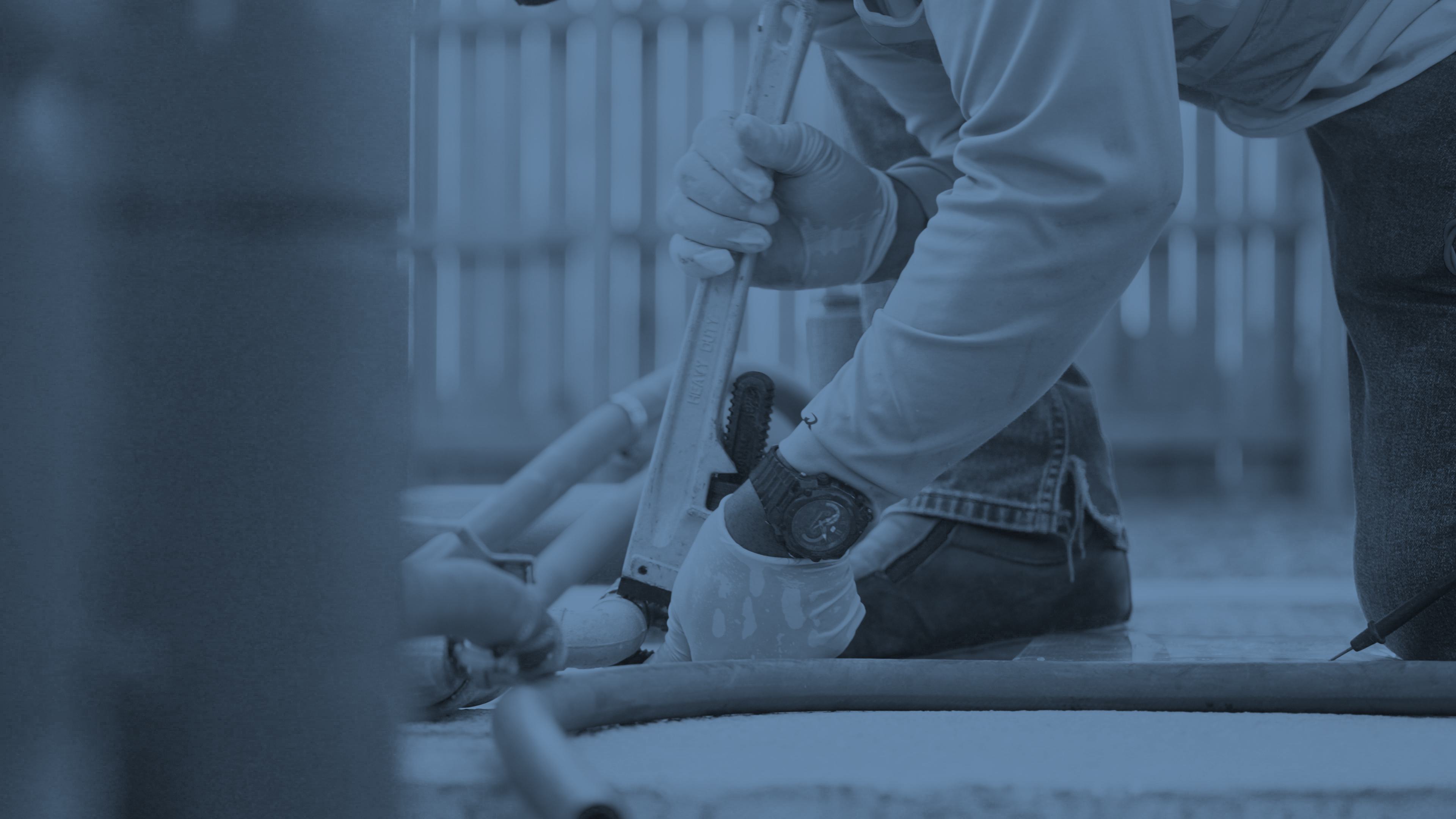 NWI worker fixing a water pipe